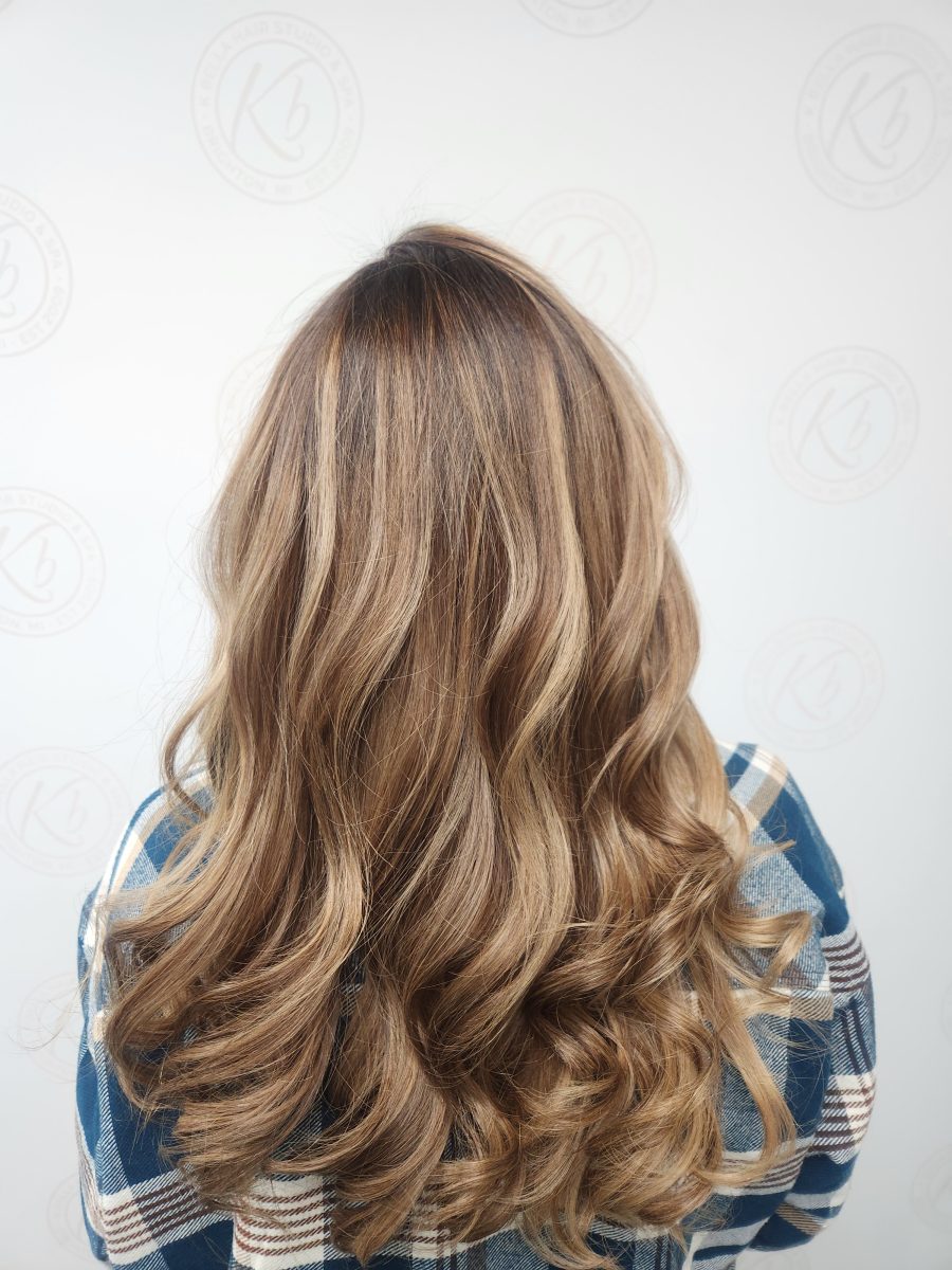 Sun-kissed balayage highlights by Siobhan Rozinski at K Bella Hair Studio & Spa in Brighton, MI