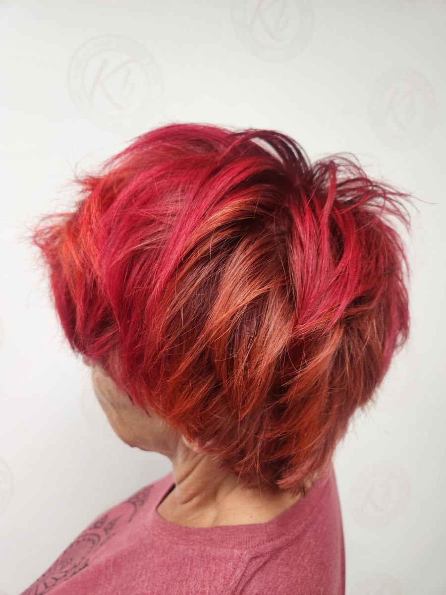 Precision Piecey vibrant retro color and choppy cut with rich custom color by Siobhan Rozinski at K Bella Hair Studio & Spa in Brighton, MI