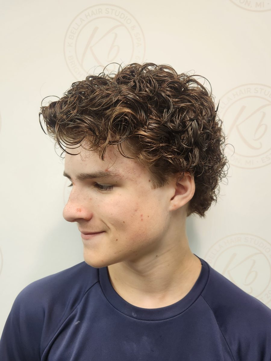 Side profile showing soft, spiraled curls throughout short hair by Siobhan Rozinski at K Bella Hair Studio & Spa in Brighton, MI